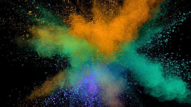 Super slowmotion shot of color powder explosion isolated on black background.