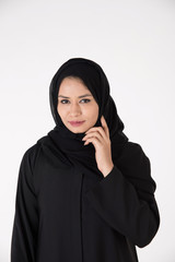 Arab woman in traditional dress on white background