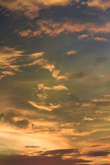 Vivid dramatic twilight sunset sky with colorful clouds and silhouettes of birds