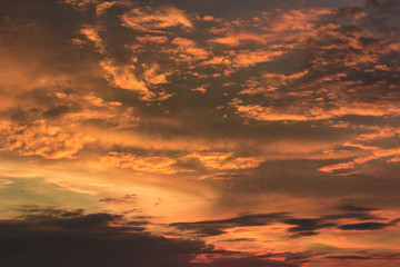 Vivid dramatic twilight sunset sky with colorful clouds and silhouettes of birds