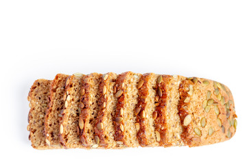 Slice of multigrain bread with sunflower and pumpkin seeds and flax seed on a white background