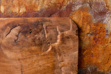 Vintage cutting board on rusty metal background
