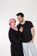 Arab couple standing and posing on white background