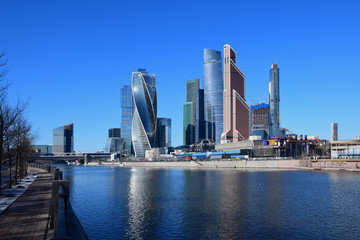 Fototapeta na wymiar High-rise buildings of the Moscow international business center Moscow-City on the bank of the Moskva River. The beginning of construction 1998. The construction continues. Russia, Moscow, April 2019.