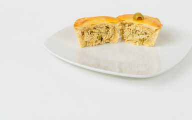 A Small Chicken Pie Sliced in half with room for copy. (Empadinha)