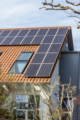 house with solar panels on rooftop