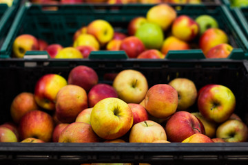 supermarket counter with fresh red and yellow apple fruits food for selling concept