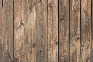 A beautiful angle texture of old yellow and brown boards with knots in the photo
