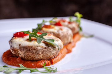 Stuffed mushrooms with parmesan crust and fresh herbs.