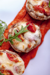 Stuffed mushrooms with parmesan crust and fresh herbs.