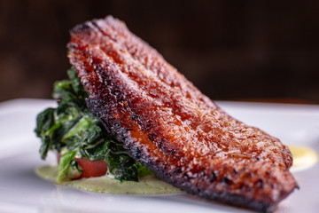 pan fried catfish with spinach and white sauce