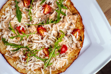 Plate with tasty potato pancakes for Hanukkah on wooden table, closeup top view