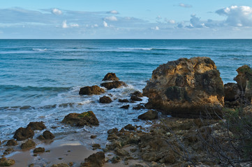 Idyllic sea, rocks and cliffs scenery in Aveiros Beach. Albufeira, Algarve, Portugal
