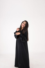 Arab woman in traditional dress on white background