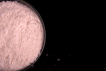 salt close up. salt on a black background.