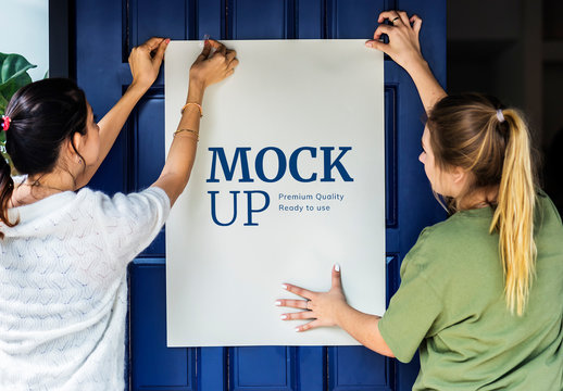 2 People Putting Up a Poster Mockup
