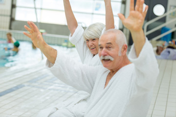 happy swimmers in swimming pool