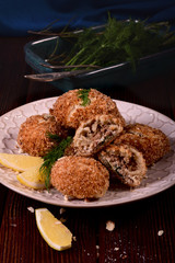 Patties with meat and nuts, breaded, baked in the oven.
