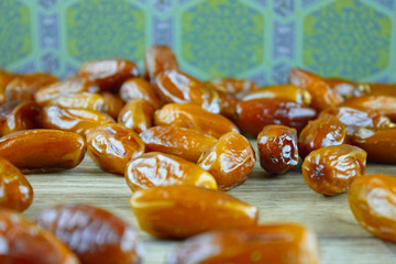 Sweet arabic algerian dates fruits on a wooden floor