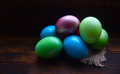 painted Easter eggs on wooden background
