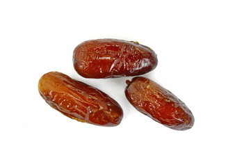 Dried dates over white background. Heap of dried dates isolated on white background.