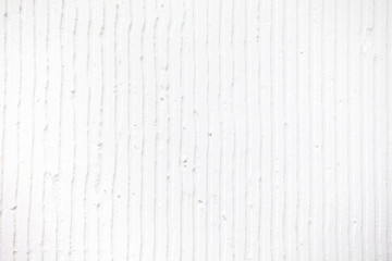 textured white background with plaster vertical lines and stripes