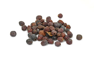 Dried medicinal herbs raw materials isolated on white. Fruit of Crataegus commonly called hawthorn,...
