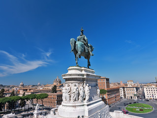 Obraz premium The Vittorio Emanuele II Monument also known as the Vittoriano, or Altare della Patria, built between the Piazza Venezia (The Venice Square) and the Capitoline Hill- the central hub of Rome .