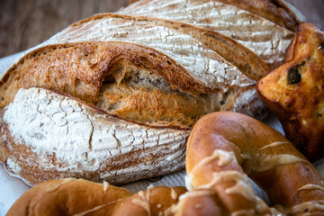 Homemade healthy freshly baked organic whole grain unleavened bread and pastry on wooden table