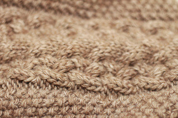 Beige knitted background medium thickness thread hobby leisure activity creativity coffee with milk abstract background