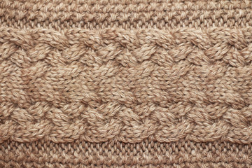 Beige knitted background medium thickness thread hobby leisure activity creativity coffee with milk abstract background