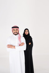 arab couple smiling and standing on white background