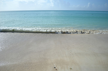 wave crashing along the shore on the island of barbuda