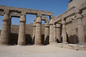 Luxor, Egypt: Columns covered with hieroglyphs at Luxor Temple, built in 1400 BC on the east bank of the Nile River.