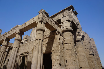 Luxor, Egypt: Columns covered with hieroglyphs at Luxor Temple, built in 1400 BC on the east bank of the Nile River.