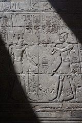Luxor, Egypt: Carvings and hieroglyphs on a wall at Luxor Temple, built in 1400 BC on the east bank of the Nile River.