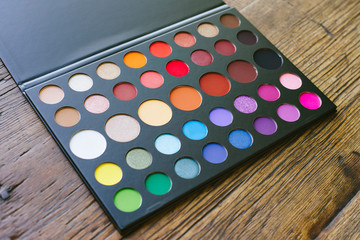 Eye shadow palette with an array of colors and circular shapes