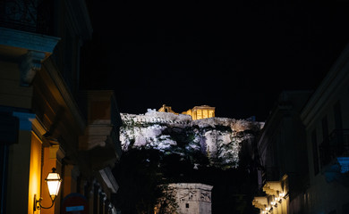 Illuminated Acropolis monument in central Athens at night view from below postcard image like 