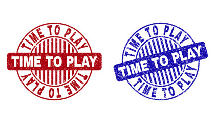 Grunge TIME TO PLAY round stamp seals isolated on a white background. Round seals with grunge texture in red and blue colors.