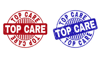 Grunge TOP CARE round stamp seals isolated on a white background. Round seals with grunge texture in red and blue colors. Vector rubber imprint of TOP CARE text inside circle form with stripes.