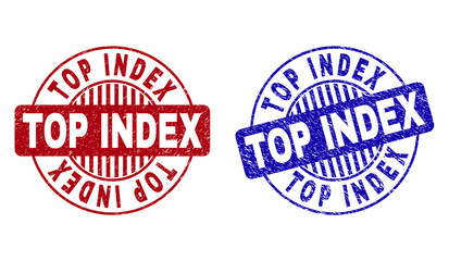 Grunge TOP INDEX round stamp seals isolated on a white background. Round seals with distress texture in red and blue colors. Vector rubber overlay of TOP INDEX text inside circle form with stripes.