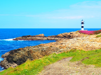 Fototapeta na wymiar View of the coast and lighthouse of Illa Pancha in Ribadeo, Lugo, Galicia - Spain