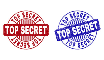 Grunge TOP SECRET round stamp seals isolated on a white background. Round seals with grunge texture in red and blue colors.