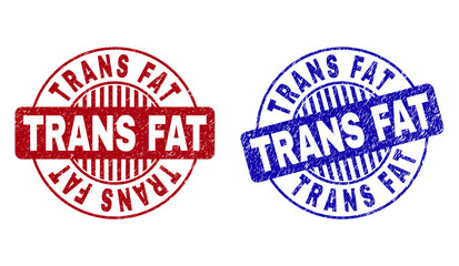 Grunge TRANS FAT round stamp seals isolated on a white background. Round seals with grunge texture in red and blue colors. Vector rubber watermark of TRANS FAT caption inside circle form with stripes.