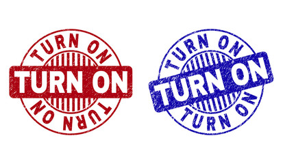 Grunge TURN ON round stamp seals isolated on a white background. Round seals with grunge texture in red and blue colors. Vector rubber imprint of TURN ON caption inside circle form with stripes.