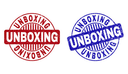 Grunge UNBOXING round stamp seals isolated on a white background. Round seals with grunge texture in red and blue colors. Vector rubber watermark of UNBOXING label inside circle form with stripes.