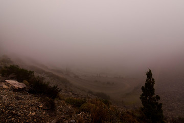 foggy gravel road in the mountains