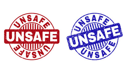 Grunge UNSAFE round stamp seals isolated on a white background. Round seals with grunge texture in red and blue colors. Vector rubber imprint of UNSAFE tag inside circle form with stripes.