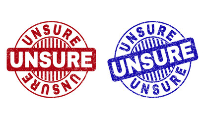 Grunge UNSURE round stamp seals isolated on a white background. Round seals with grunge texture in red and blue colors. Vector rubber imprint of UNSURE tag inside circle form with stripes.
