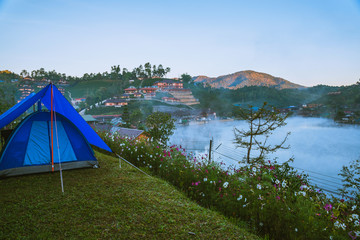 The concept of setting up a mountain camp, Camping Tent, Travel relax. Landscapes, nature, fog touch at Thailand.